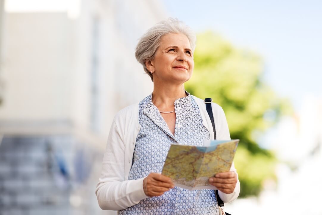 Mature woman looking at map